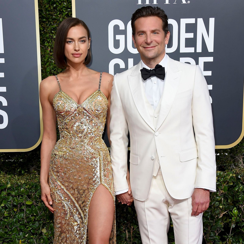 Sem camisa Bradley Cooper e ex Irina Shayk alimentam e nadam com porcos durante as férias: fotos raras
